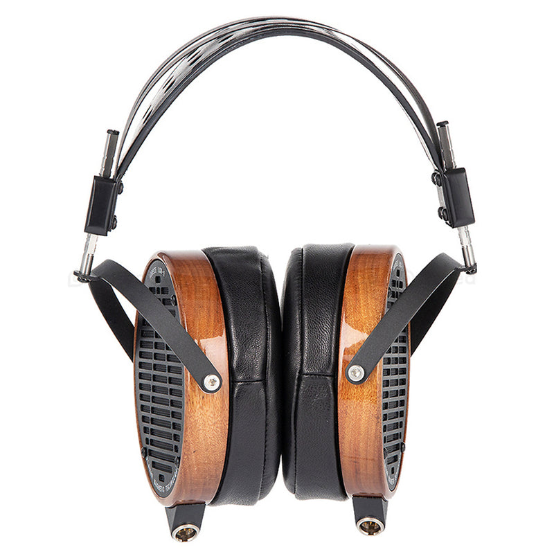 Headphones with wood accents, earpads placed together